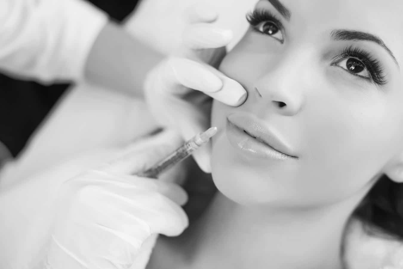 Woman-botox-dental-treatment-smile Beautiful woman with youthful smile receives botox dental treatment