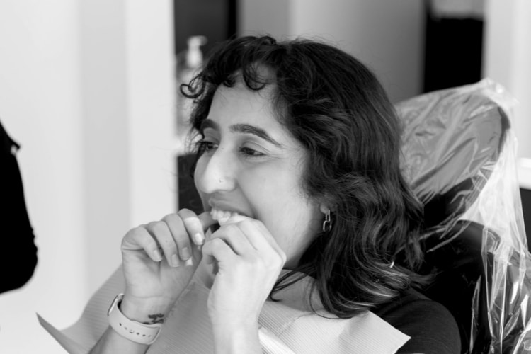 Girl putting in clear retainers